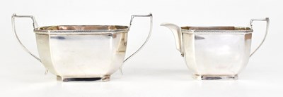 Lot 894 - REID & SONS; a George V hallmarked silver milk...