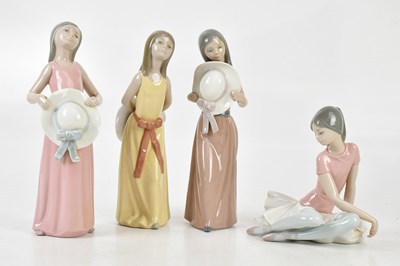 Lot 160 - LLADRO; a collection of four figures, two...
