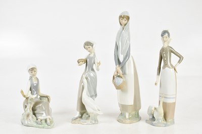 Lot 161 - LLADRO; a collection of four figures including...