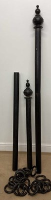 Lot 505 - A large early 20th century ebonised curtain...