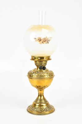 Lot 2426 - A brass oil lamp, with floral transfer...