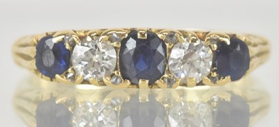 Lot 1167 - An 18ct gold diamond and sapphire set ring,...