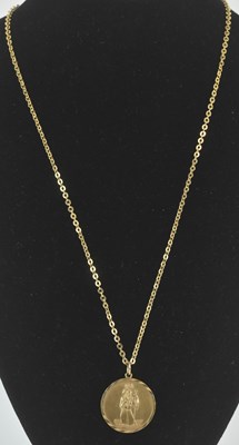 Lot 1221 - A 9ct gold St Christopher circular pendant,...