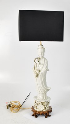 Lot 149 - A Chinese blanc de chine lamp modelled as...