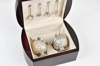 Lot 1480 - A pair of Eastern white metal salts and spoons,...