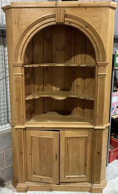 Lot 710 - A large freestanding pine corner cupboard with...