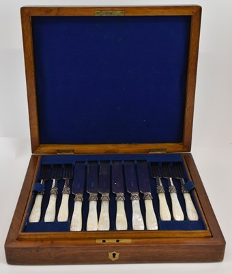 Lot 1005 - A late 19th/early 20th century walnut and oak...