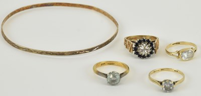 Lot 1135 - A 9ct gold illusion set diamond and sapphire...