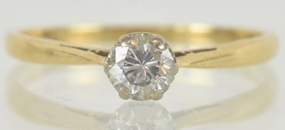 Lot 1186 - An 18ct gold diamond solitaire ring in four...
