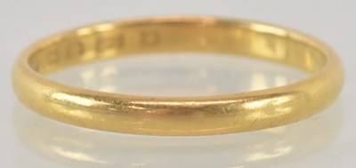 Lot 1168 - A 22ct yellow gold wedding band, size N,...