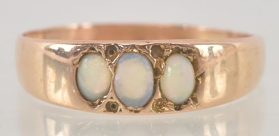 Lot 1184 - A yellow metal opal set ring, size O/P, approx...