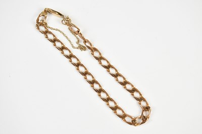 Lot 1590 - A yellow metal curb link bracelet, stamped '9K'...