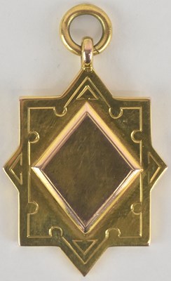Lot 1226 - A 9ct gold prize fob of star and shield shape,...