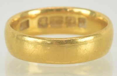 Lot 1163 - A 22ct gold band ring, size J, approx 4.5g.