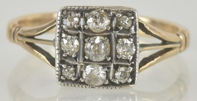 Lot 1169 - An Art Deco 18ct gold ring, the square table...