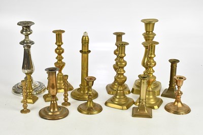 Lot 1388 - Six pairs of brass candlesticks and four...