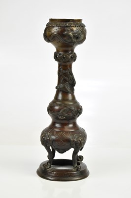 Lot 28 - A Japanese bronze candle holder, height 31cm.
