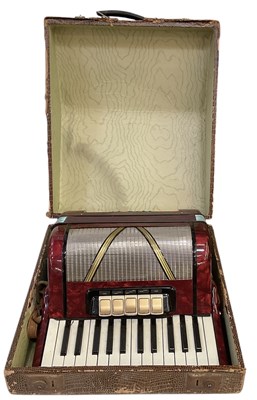 Lot 428 - A 1950s cased piano accordion.