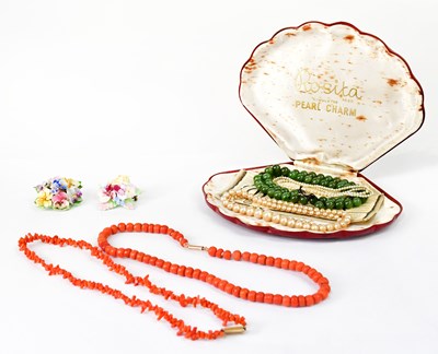Lot 1127 - A coral beaded necklace with a 9ct rose gold...