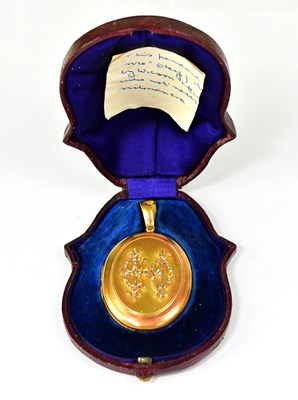 Lot 1081 - A Victorian yellow metal mourning locket...