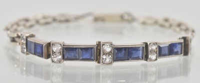 Lot 1315 - A white metal bracelet, with four links each...