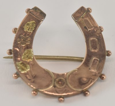 Lot 1296 - A 9ct yellow gold horseshoe brooch, 2 x 2cm,...