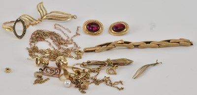 Lot 1130 - A quantity of scrap 9ct yellow gold and yellow...