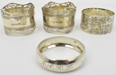 Lot 1126 - Four hallmarked silver napkin rings,...