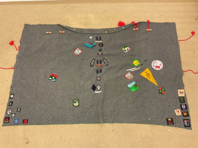 Lot 25 - A Boy Scouts blanket cloak, decorated with...