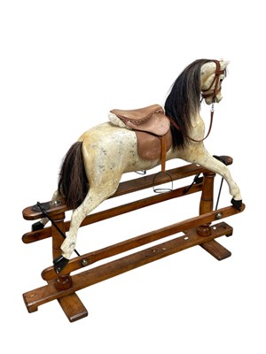 Lot 605 - A vintage grey painted rocking horse, with...