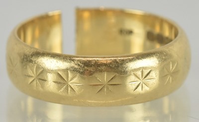 Lot 1172 - An 18ct gold band ring with cut shank, size N...