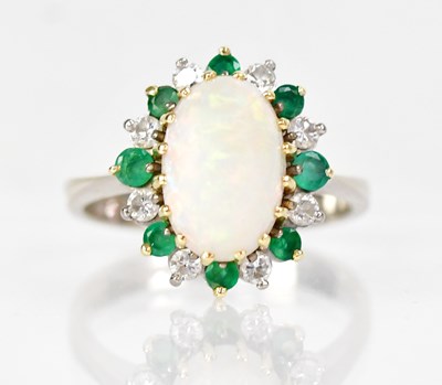 Lot 1014 - An 18ct white gold ring set with an oval opal...