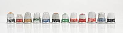 Lot 1354 - Twelve vintage advertising thimbles, including...