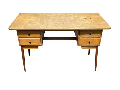 Lot 2314 - A mid century plywood and beech desk, with...