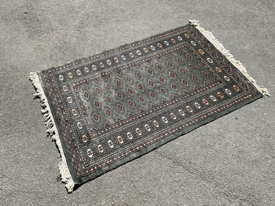Lot 2324 - A Caucasian hand woven wool rug, decorated...