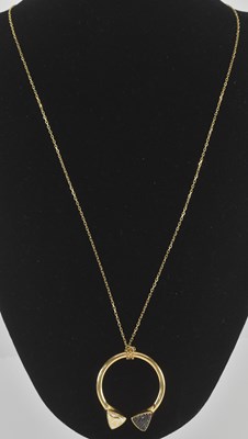 Lot 1211 - An 18ct yellow gold marcasite and white enamel...