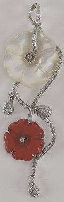 Lot 1210 - An 18ct white gold mother of pearl, coral and...