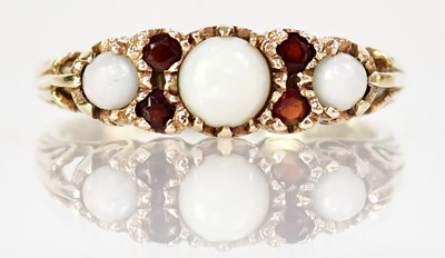 Lot 1032 - A 9ct yellow gold ring set with three...