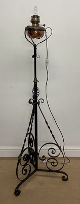 Lot 673 - A 19th century wrought iron converted lamp,...