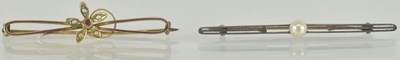 Lot 1300 - Two 9ct gold brooches, comprising a yellow...