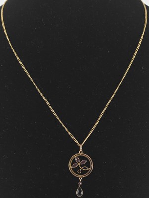 Lot 1246 - A 9ct gold circular necklace pendant, with...