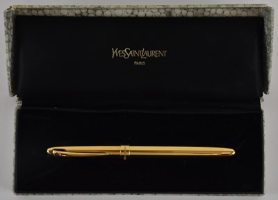 Lot 438 - YVES SAINT LAURENT; a gold plated fountain pen,...
