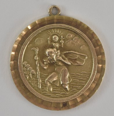 Lot 1231 - A 9ct yellow gold St Christopher pendant,...