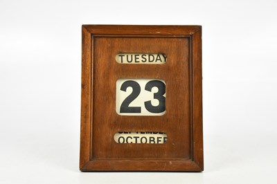 Lot 1327 - A perpetual wall mounted calendar, 29cm.