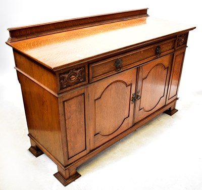 Lot 107 - An Arts and Crafts oak sideboard, with a...
