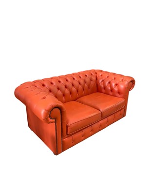 Lot 2195 - An orange leather button back Chesterfield...