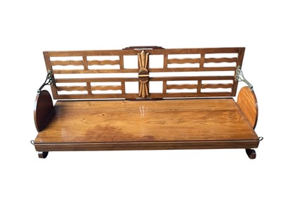 Lot 2098 - An Indian carved Art Deco style swing bench,...