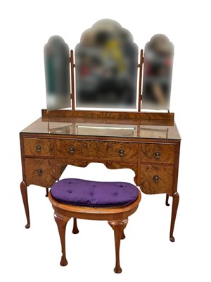 Lot 2162 - A walnut dressing table with an arrangement of...