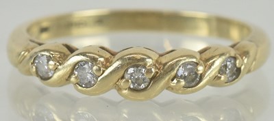 Lot 1199 - A 9ct gold ring, set with five small diamonds,...