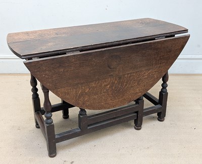 Lot 2271 - An 18th century oak drop-leaf gateleg dining...